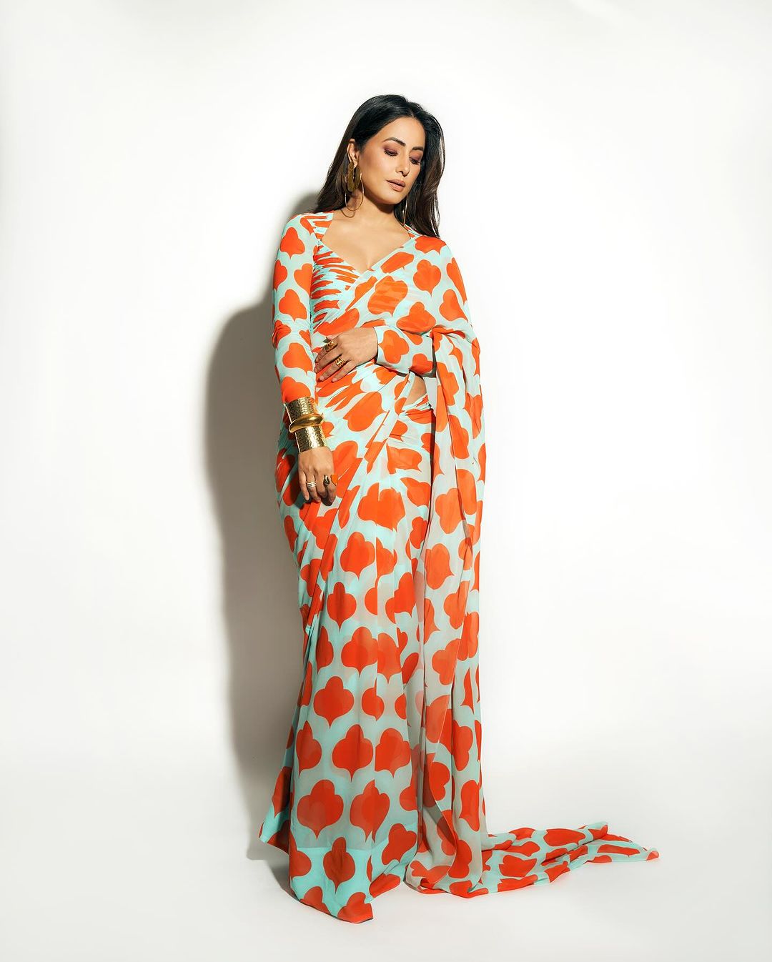 Bollywood Actress Hina Khan Stills in Orange Saree